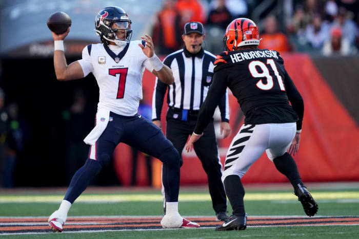 Houston Texans quarterback C.J. Stroud (7) throws under pressure from Cincinnati Bengals defensive end Trey Hendrickson (91) in the second quarter of a Week 10 NFL football game between the Houston Texans and the Cincinnati Bengals, Sunday, Nov. 12, 2023, at Paycor Stadium in Cincinnati.